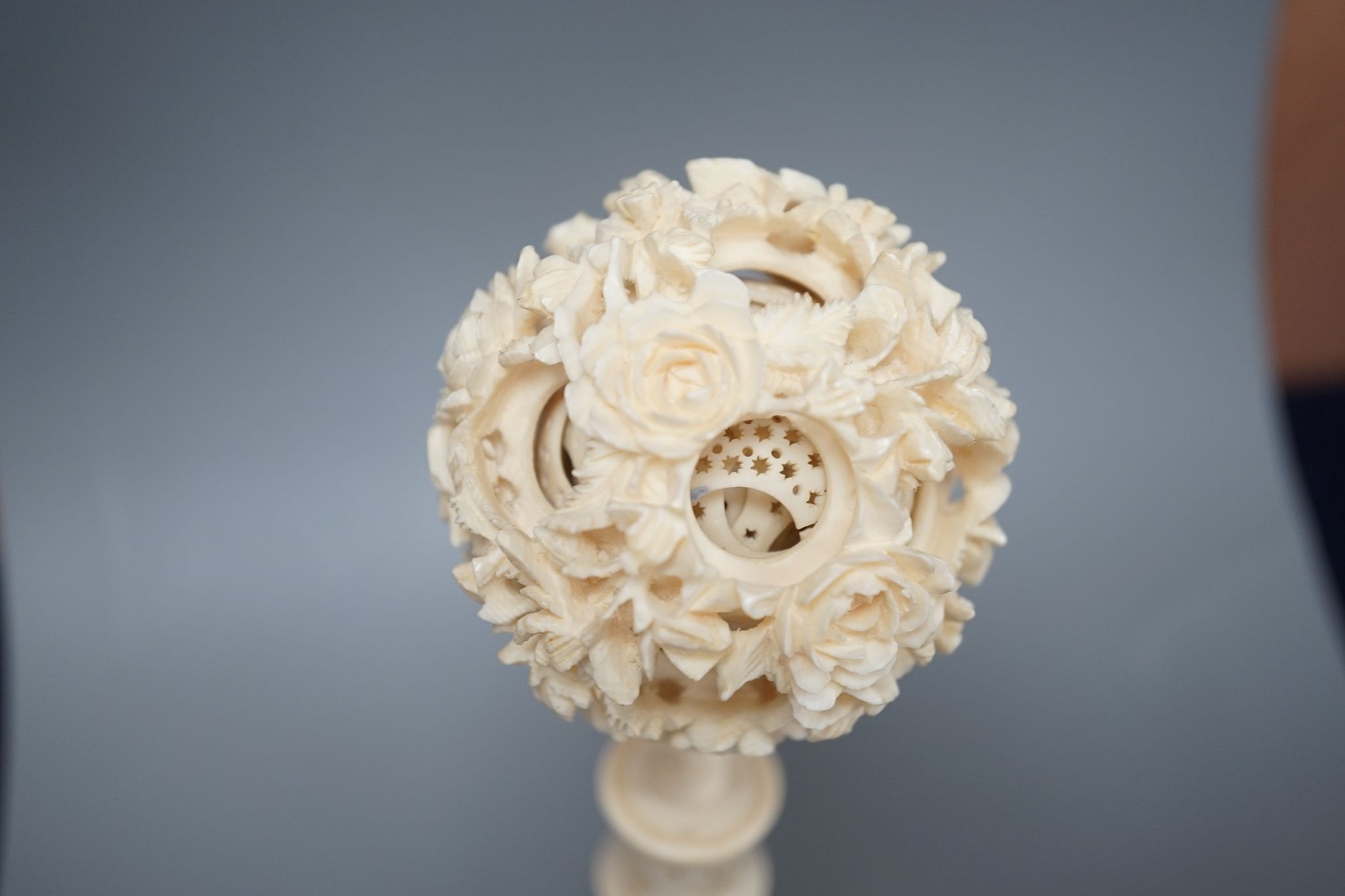 An early 20th century Chinese ivory concentric puzzle ball and stand 20cm total height